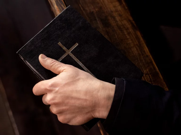 Man Holding Bible in Church