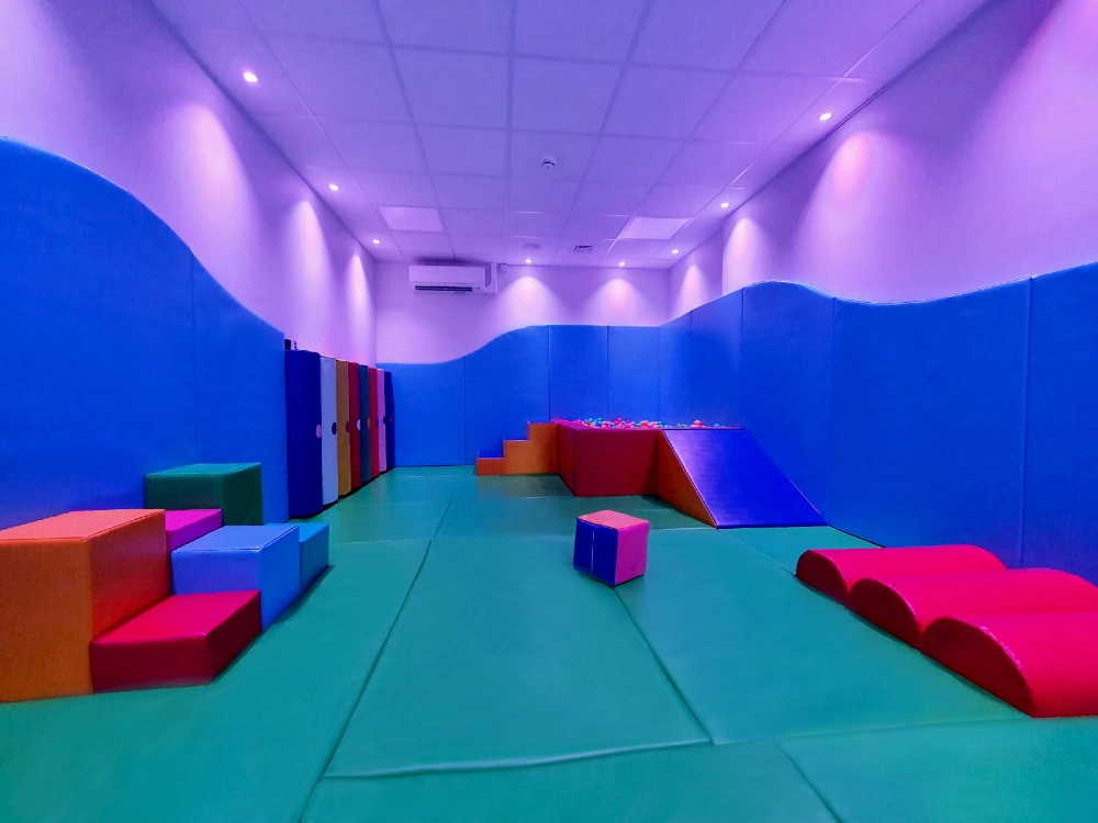 Interactive sensory lighting integrated into a soft play environment
