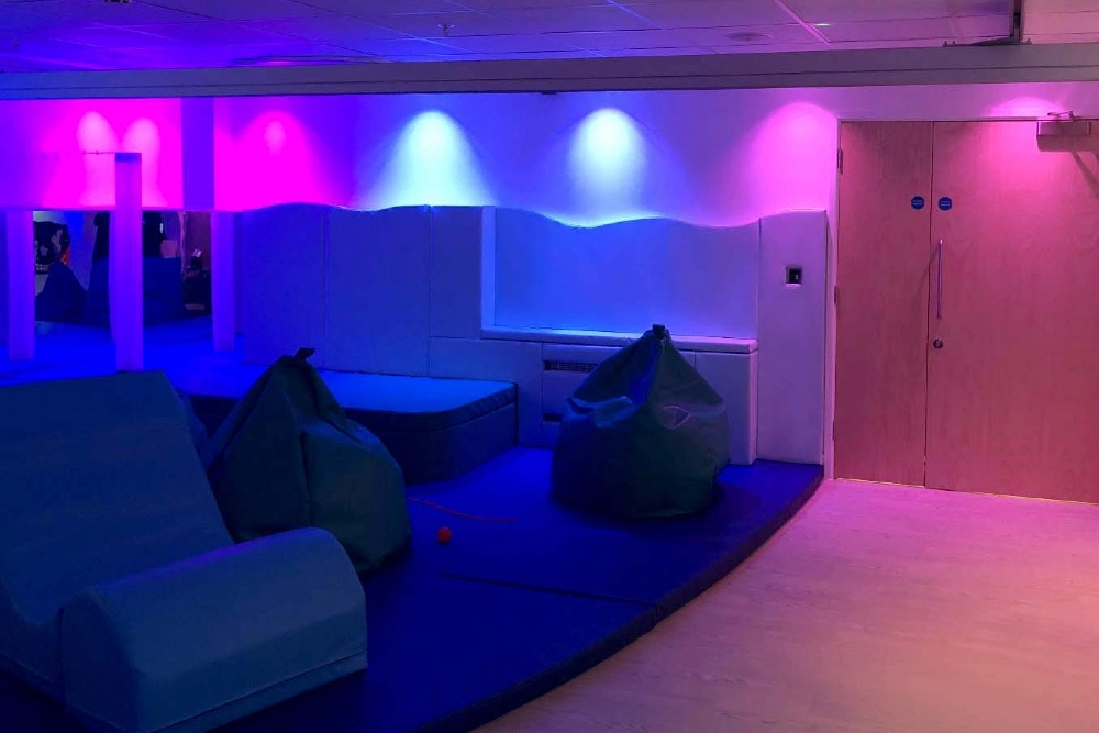 Relaxing sensory space with soft furnishings for adult residential care