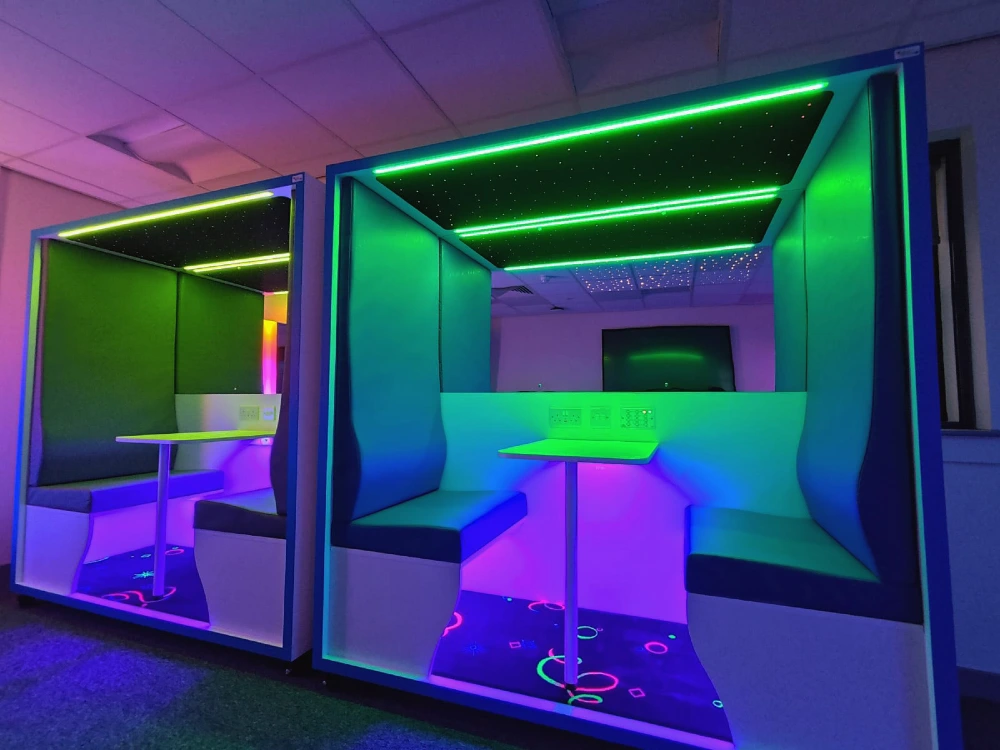 Interior of the Sensory Focus Pod showing the workstation and bench seating.