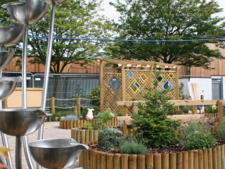 Rainbow Pergola and Water feature in sensory garden