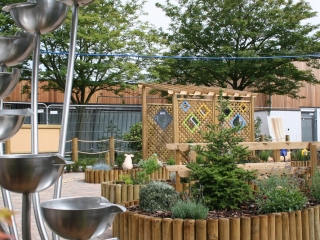 Rainbow Pergola and Water feature in sensory garden
